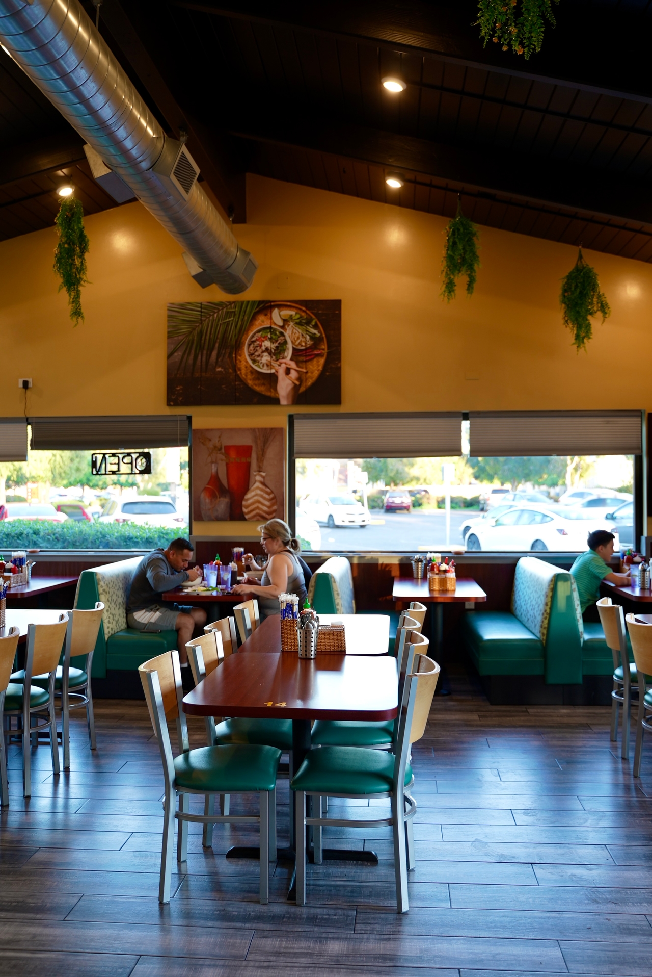 Warm and inviting interior of iPho restaurant showcasing comfortable dining area